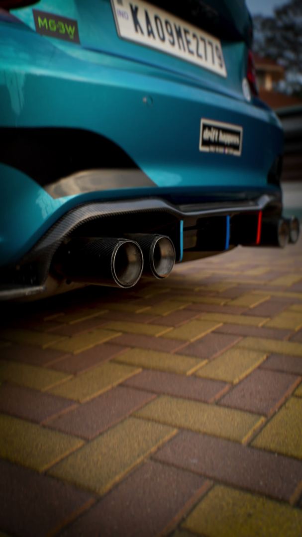 Quad exhaust tips of the BMW M2, shot low.
