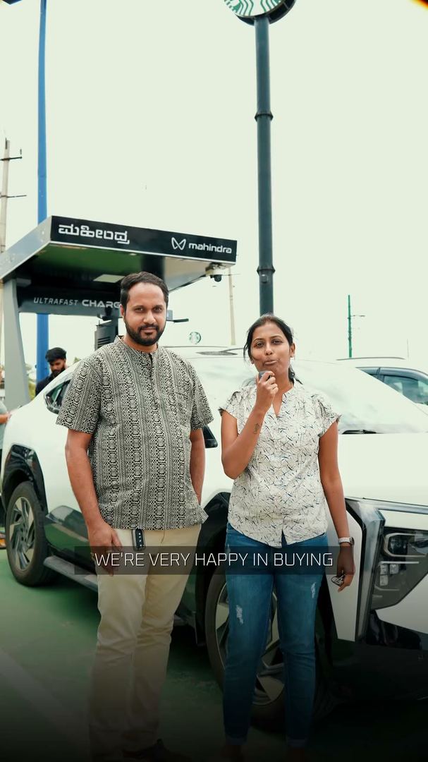 Owners speak to camera at a highway charging station.