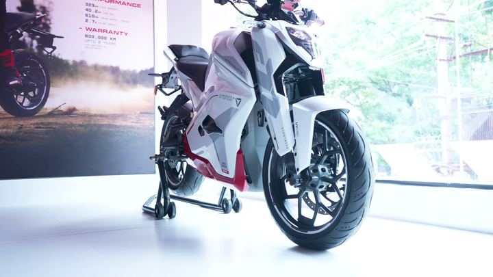 White Ultraviolette motorcycle by the showroom window.