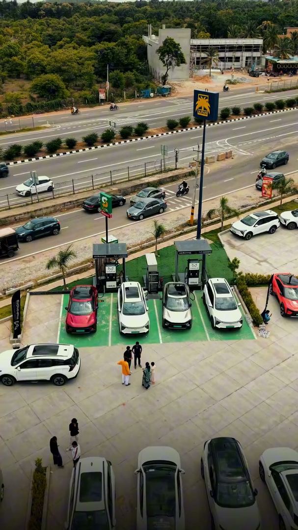 Aerial view of the charging plaza beside a busy highway.