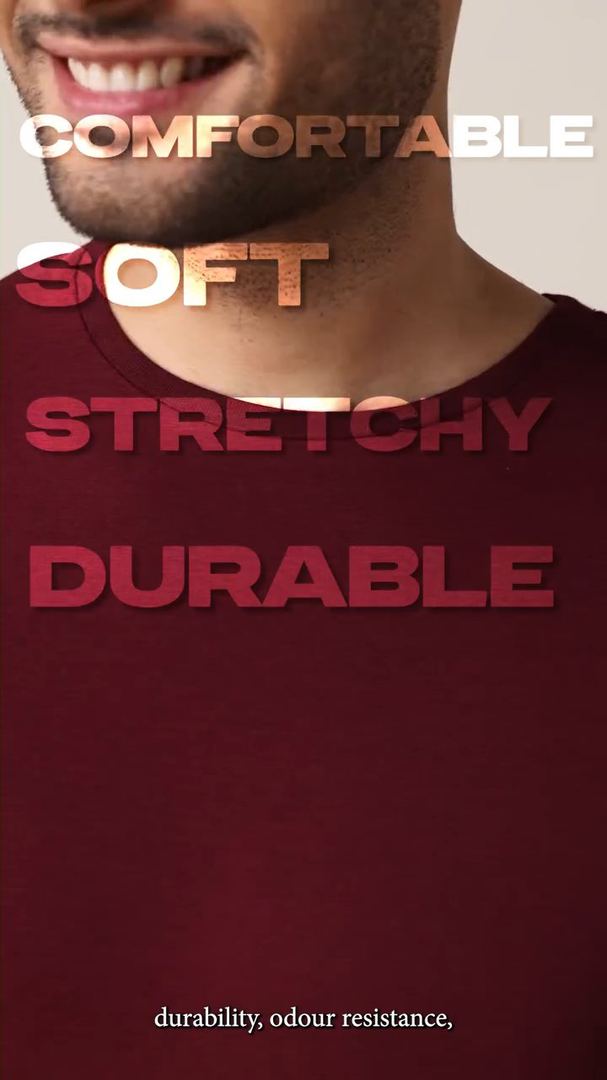 Close-up of a smiling model with the words comfortable, soft, stretchy, durable.