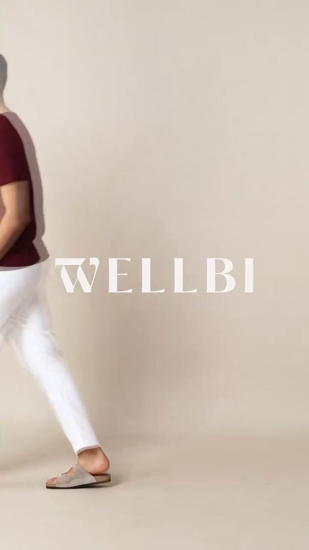 Wellbi wordmark over a beige studio backdrop.