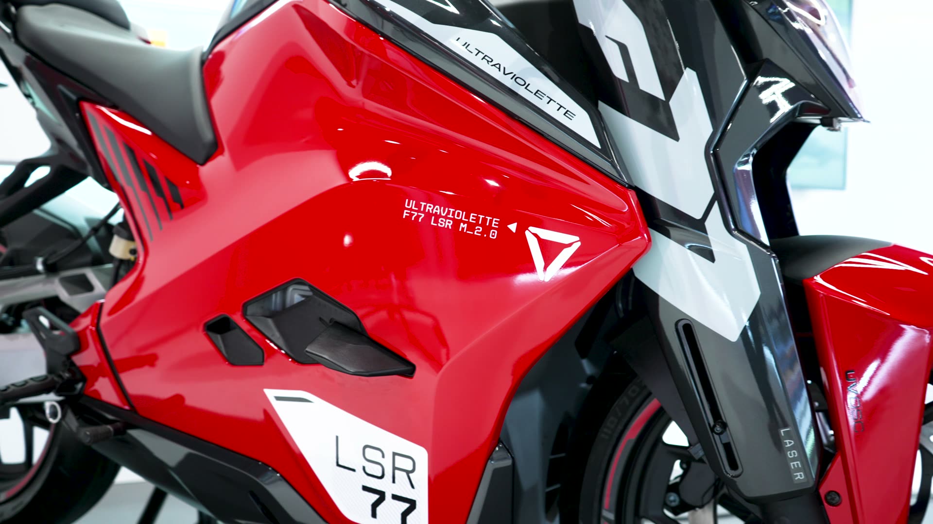 Close-up of a red Ultraviolette motorcycle fairing from our launch film.